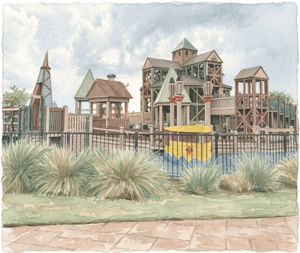 A large wooden playground structure with multiple towers, green roofs, and a yellow and blue boat play area.